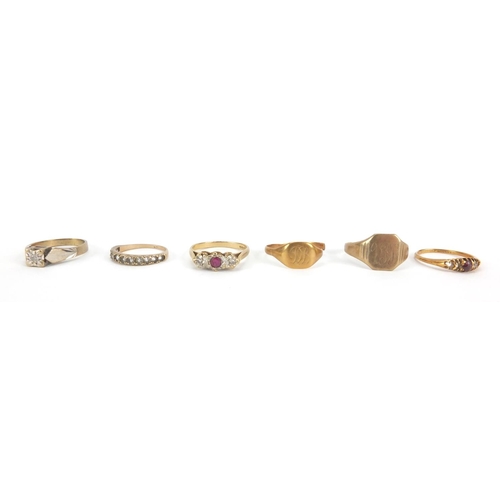 2605 - Six 18ct and 9ct gold rings, some set with stones and a 9ct gold wristwatch, approximate weight  23.... 