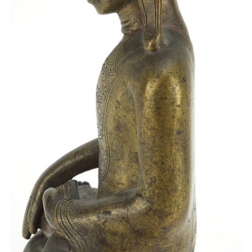 603 - Antique Thai bronze seated figure of Buddha, script to the reverse, 26cm high