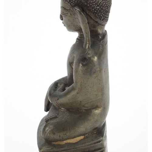 604 - Antique Thai patinated bronze seated figure of Buddha, script to the reverse, 18.5cm high