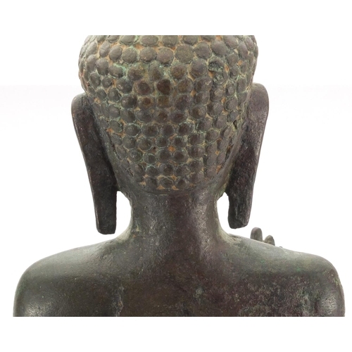 605 - Antique Thai patinated bronze standing figure of Buddha, on a later wooden stand, overall 61cm high