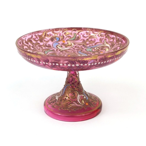 2257 - Pink glass pedestal glass dish, enamelled with floral swags, 7cm high