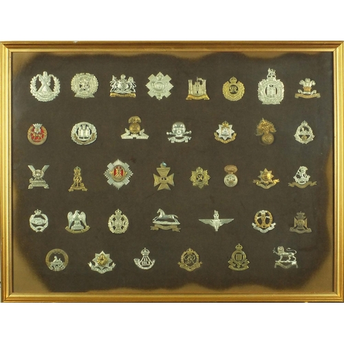 276 - Two framed displays of British Military cap badges including The Welch, Seventh Queen own Hussars, A... 