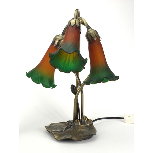 2219 - Art Nouveau style three branch desk lamp together with a desk lamp, all with orange and green frille... 