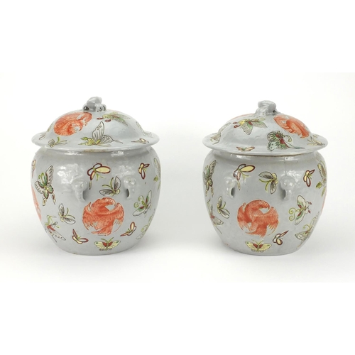 2228 - Pair of Chinese porcelain jars and covers, both hand painted with butterflies amongst roundels of Ph... 