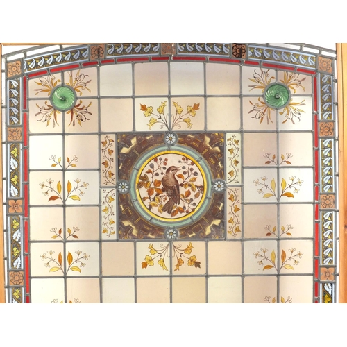 2107 - Large leaded stain glass window hand painted with birds and flowers, overall 160cm x 101cm