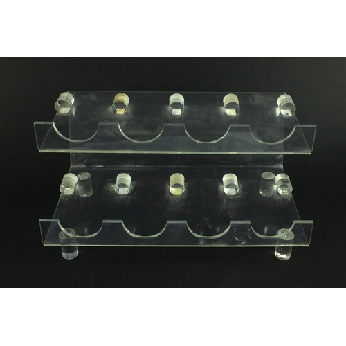 2274 - Modernist bent Perspex wine rack, 23cm high