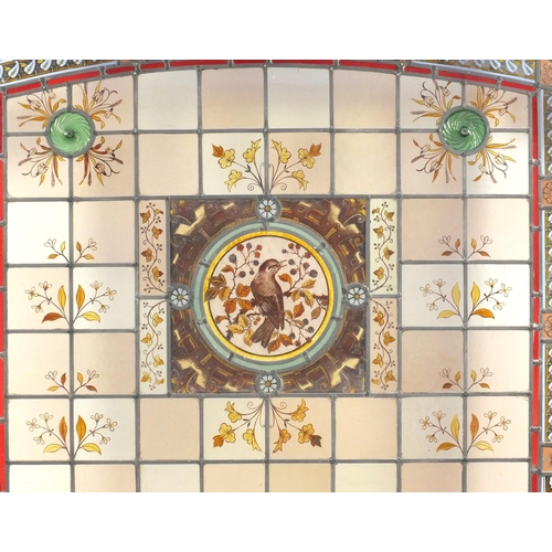 2107 - Large leaded stain glass window hand painted with birds and flowers, overall 160cm x 101cm