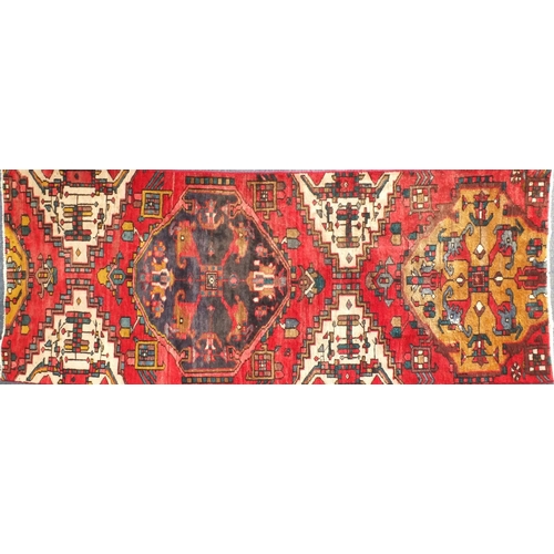 2096 - Rectangular Persian Backhtiar rug, having all over geometric motifs onto a predominantly red ground,... 