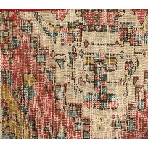 2096 - Rectangular Persian Backhtiar rug, having all over geometric motifs onto a predominantly red ground,... 