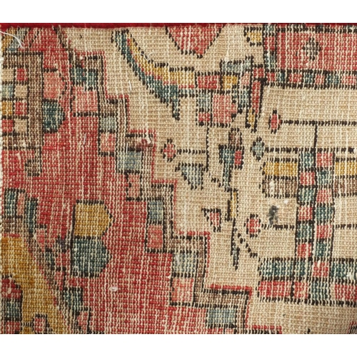 2096 - Rectangular Persian Backhtiar rug, having all over geometric motifs onto a predominantly red ground,... 