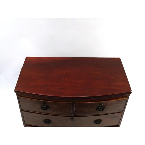 2 - Regency mahogany bow front four drawer chest of small proportions, fitted with two short above two l... 