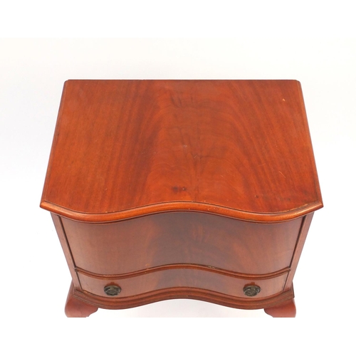 57 - Mahogany sewing table and contents raised on cabriole legs, 77cm high