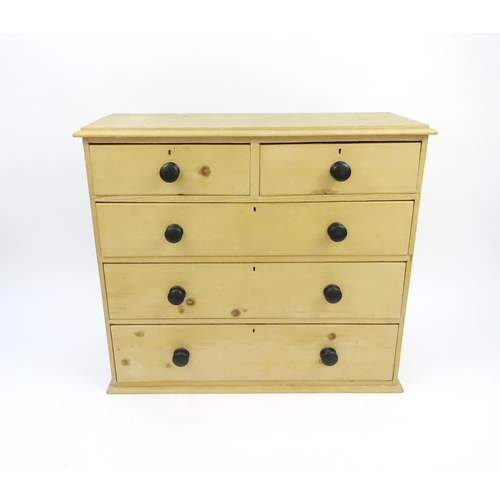 38 - Pine chest of drawers fitted with two short above three long drawers, 94cm high x 105cm wide x 40cm ... 