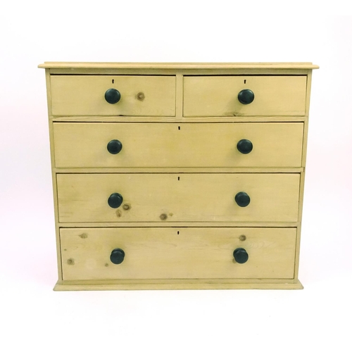 38 - Pine chest of drawers fitted with two short above three long drawers, 94cm high x 105cm wide x 40cm ... 