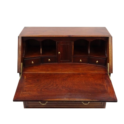 16 - Hardwood bureau with pull down front, fitted interior and four drawers, 101cm high x 41cm wide x 97c... 