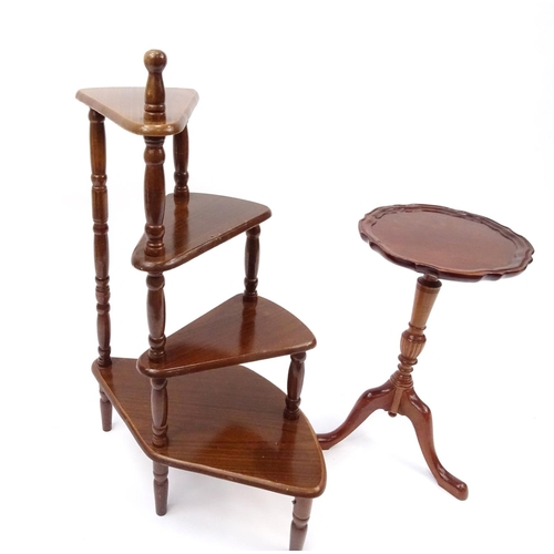 39 - Four tier plant stand and a mahogany wine table