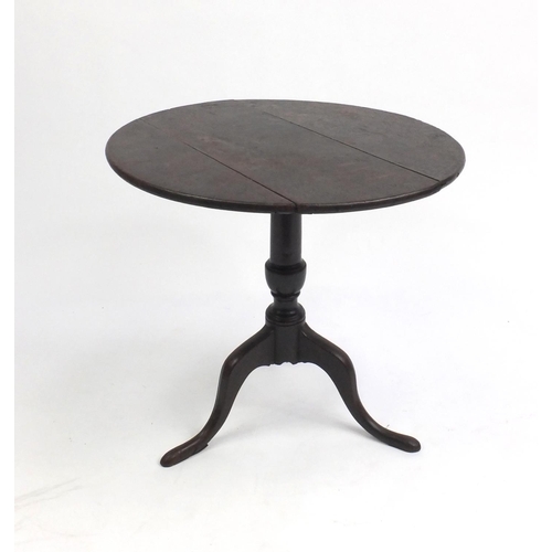 37 - Antique circular oak tilt top occasional table, with tripod base, 56cm high x 58cm in diameter