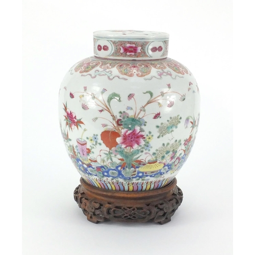 457 - Chinese porcelain ginger jar and cover on carved rosewood stand, the jar finely hand painted in the ... 