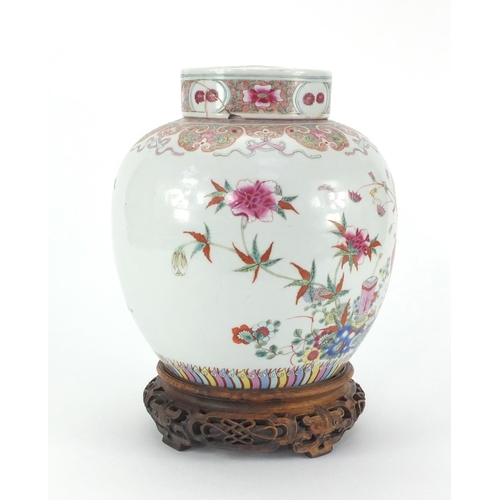 457 - Chinese porcelain ginger jar and cover on carved rosewood stand, the jar finely hand painted in the ... 