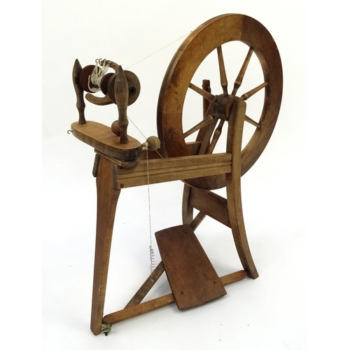 56 - Oak spinning wheel, 85cm high