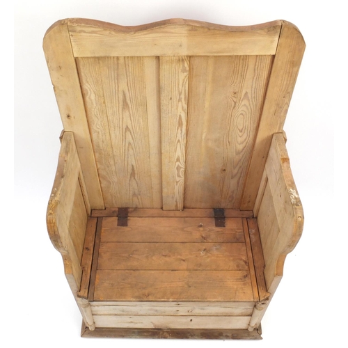 15 - Antique stripped pine settle with lift up seat, 125cm high x 72cm wide x 36cm deep