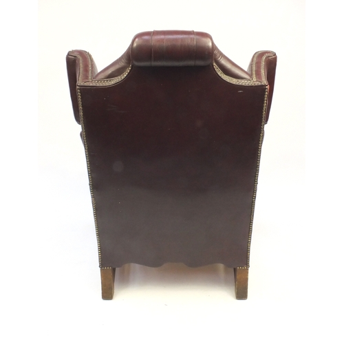 2031A - Brown leather wing back armchair with button back upholstery, 115cm high