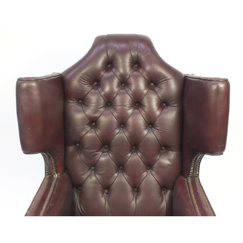 2031A - Brown leather wing back armchair with button back upholstery, 115cm high