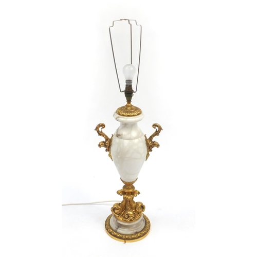 2102a - Alabaster table lamp with gilt dolphin support and twin handles, 67cm high