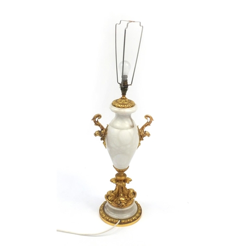 2102a - Alabaster table lamp with gilt dolphin support and twin handles, 67cm high