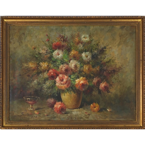 47 - Oil onto canvas, still life flowers in a vase, bearing a signature H Cachard 1957, gilt framed, 78cm... 