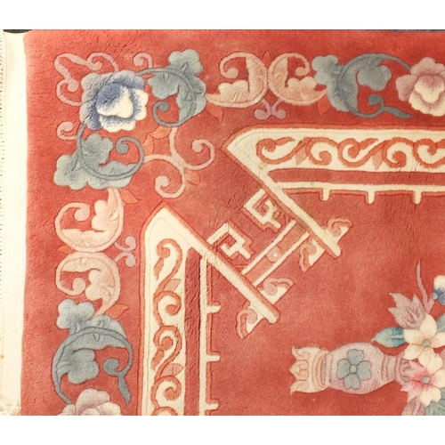 19 - Chinese salmon ground floral carpet, 280cm x 185cm