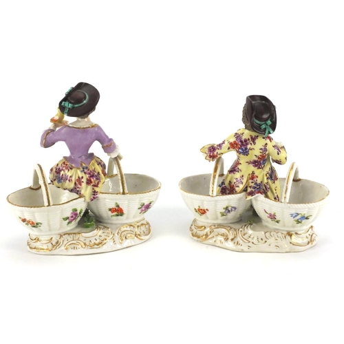 660 - 19th century pair of continental porcelain figural double baskets, both hand painted with flowers, b... 