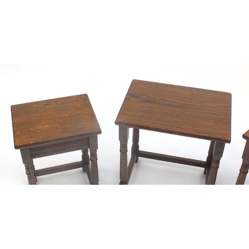 54 - Nest of three oak occasional tables, the largest 48cm high x 51cm wide x 35cm deep