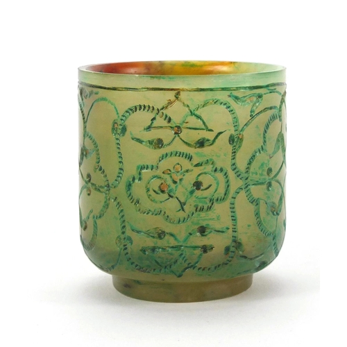 634 - Islamic green jade cup decorated with floral motifs, 5.2cm high