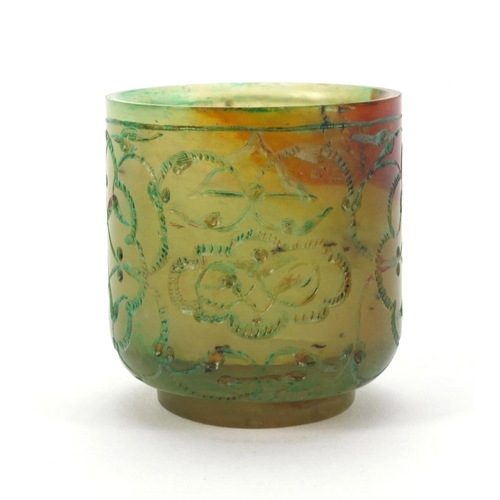 634 - Islamic green jade cup decorated with floral motifs, 5.2cm high