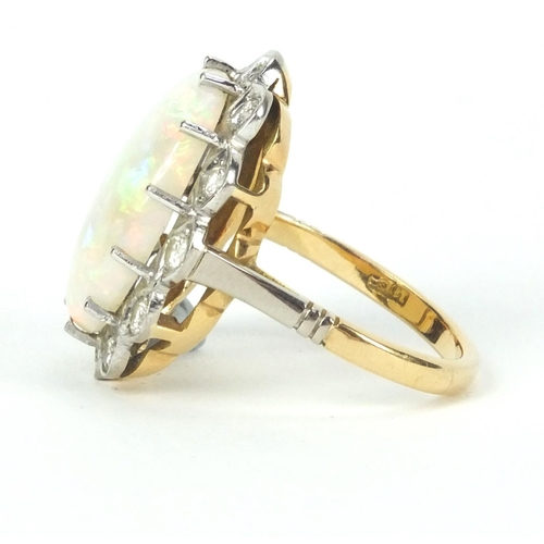 903 - 18ct gold opal and diamond ring set with twelve diamonds, size N, approximate weight 7.7g