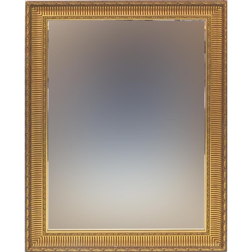 44 - Large ornate gilt framed bevel edged mirror, 107cm x 76cm