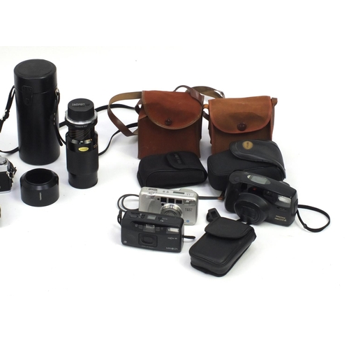 214 - Vintage and later cameras including Pentax, Olympus, Kodak exmples and a Tamron 80 x 120mm lense