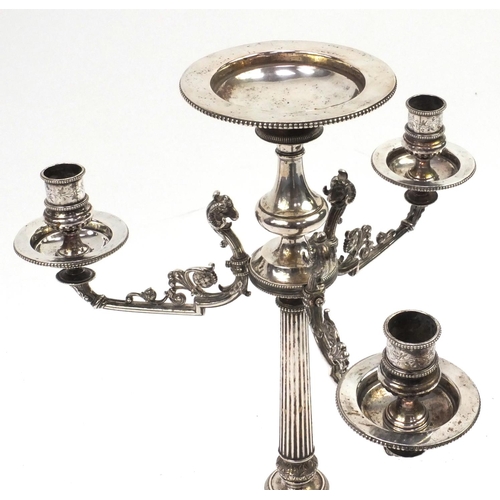 105 - Silver plated centre piece with three rams head candlestick branches, 51cm high