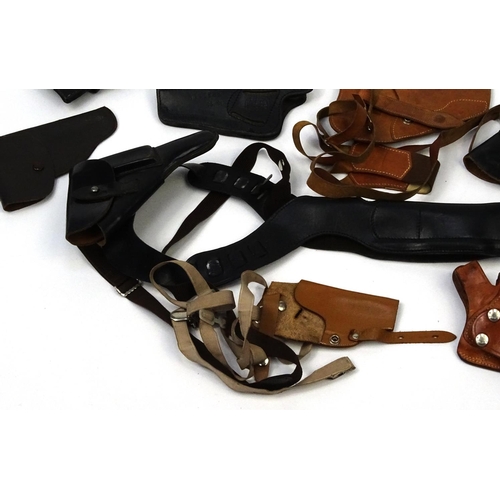 640 - Mixed Military interest pistol holsters including Walther examples