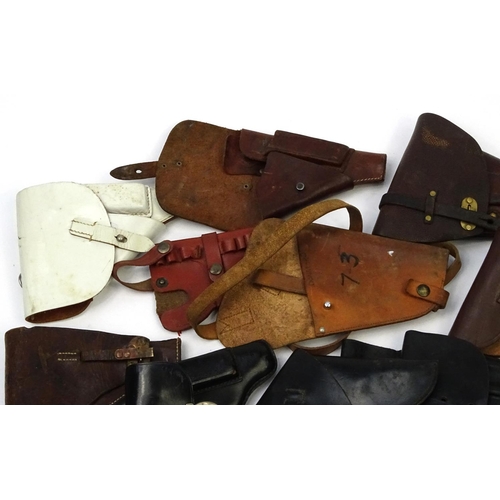 638 - Mixed leather pistol holsters including a Watlher example