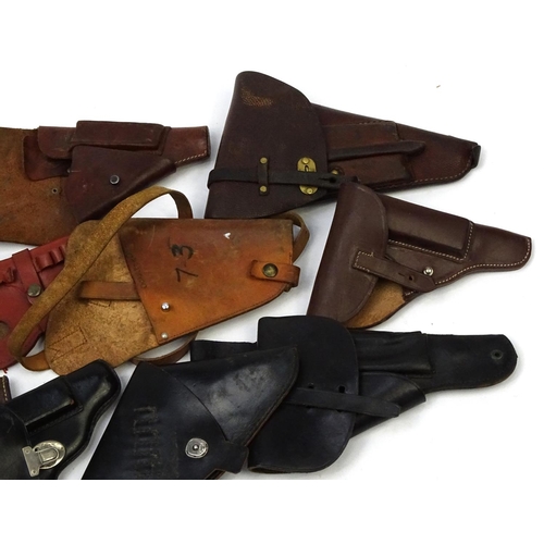 638 - Mixed leather pistol holsters including a Watlher example