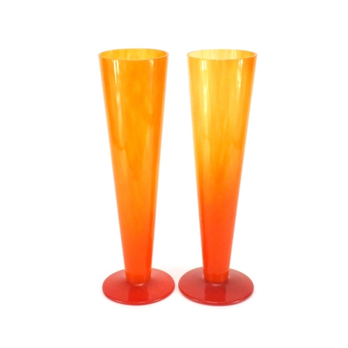 113 - Pair of orange glass fluted vases, 40cm high