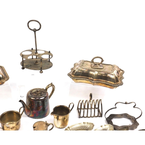 219 - Silver plated items including two entrée dishes and a cruet stand, including Mappin & Webb examples