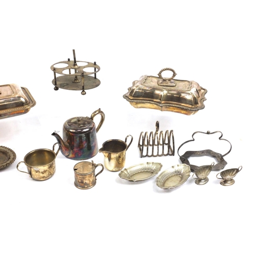 219 - Silver plated items including two entrée dishes and a cruet stand, including Mappin & Webb examples