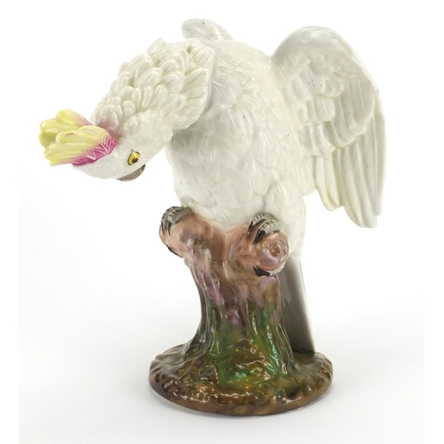 435 - Continental hand painted porcelain model of a cockatoo, blue under glaze factory marks to the base, ... 