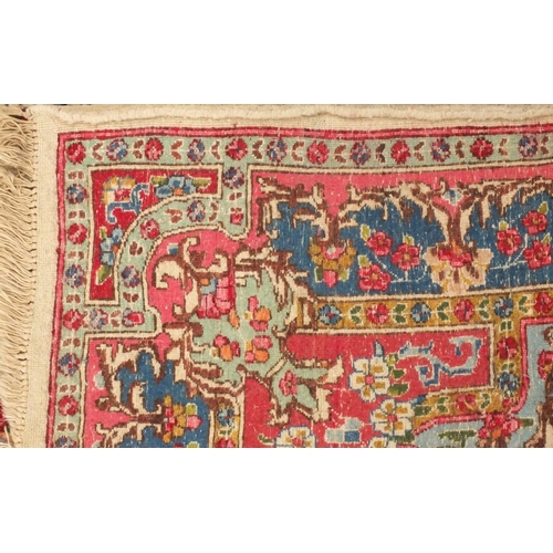 34 - Rectangular Persian Kerman rug with floral design onto a predominantly beige and pink ground, 225cm ... 