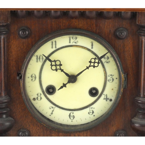 107 - Edwardian walnut striking mantle clock, 42cm high