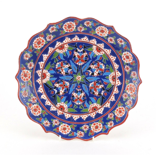 413 - Turkish hand painted Kutahya pottery plate, 30cm in diameter