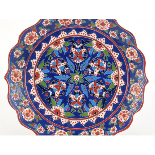 413 - Turkish hand painted Kutahya pottery plate, 30cm in diameter